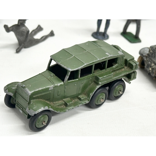 531 - A collection of vintage Britains and Dinky military vehicles and figures.