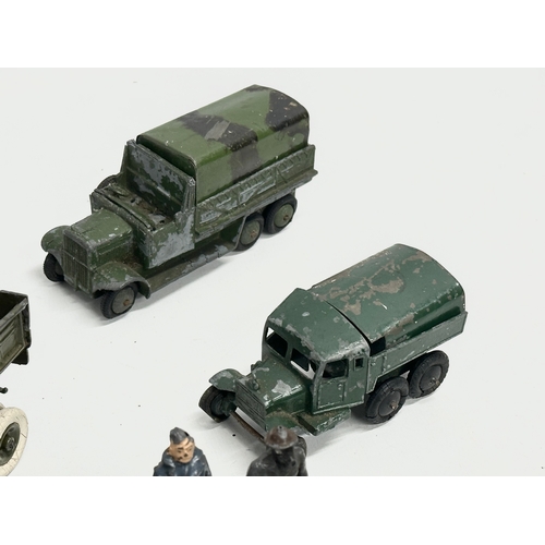 531 - A collection of vintage Britains and Dinky military vehicles and figures.