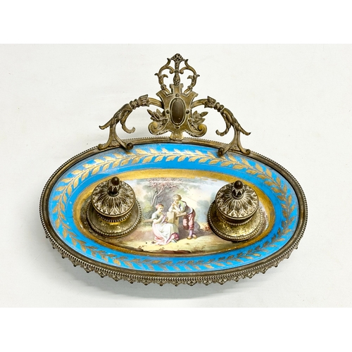 55 - A late 19th century French ornate brass framed inkwell stand with hand painted porcelain bowl. Sevre... 