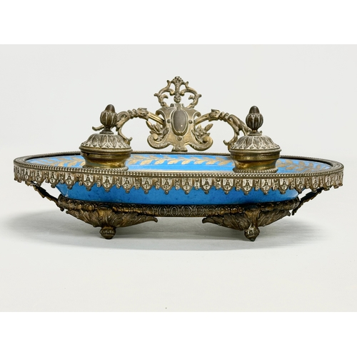 55 - A late 19th century French ornate brass framed inkwell stand with hand painted porcelain bowl. Sevre... 