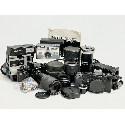 544 - A collection of vintage cameras and lenses. Ricoh KR-10 Super camera, Pentax A3 camera, Polaroid Sun... 