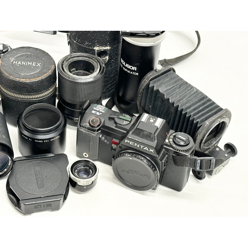 544 - A collection of vintage cameras and lenses. Ricoh KR-10 Super camera, Pentax A3 camera, Polaroid Sun... 