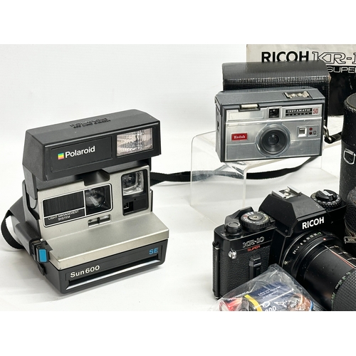 544 - A collection of vintage cameras and lenses. Ricoh KR-10 Super camera, Pentax A3 camera, Polaroid Sun... 