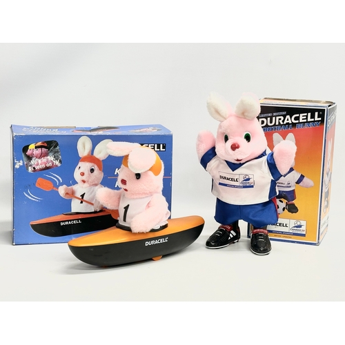 546 - Duracell. A Duracell Kayaking Bunny with box and a Duracell Football Bunny with box. 35cm