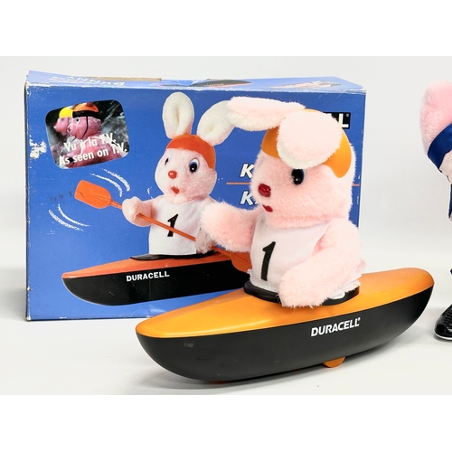 546 - Duracell. A Duracell Kayaking Bunny with box and a Duracell Football Bunny with box. 35cm