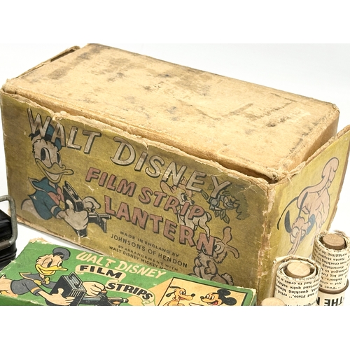 550 - A vintage Walt Disney Film Strip Lantern with accessories. Made by Johnson’s of Hendon.