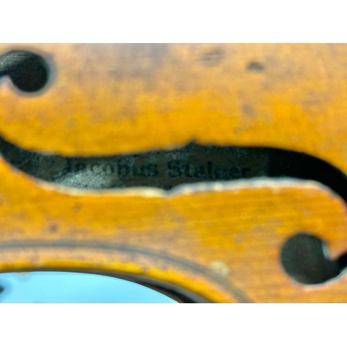 553 - A violin parts stamped Jacobus Stainer. Stamped Stainer on back.