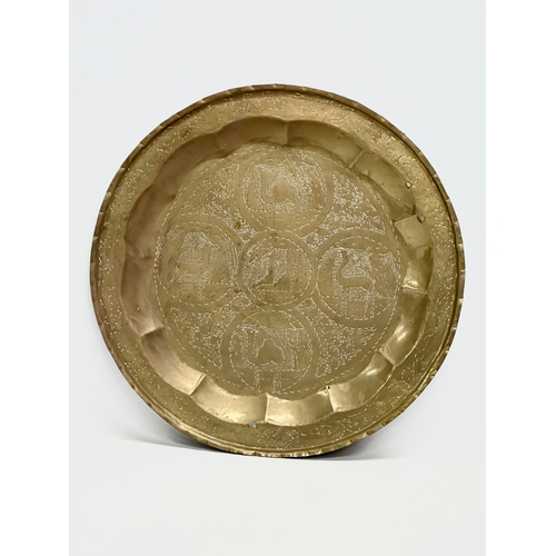 759 - A large early 20th century North African/Moroccan brass tray. 54cm