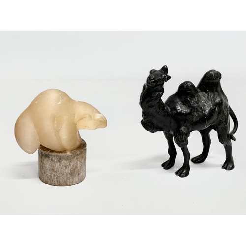 720 - A collection of 20th century stone and wooden animals.