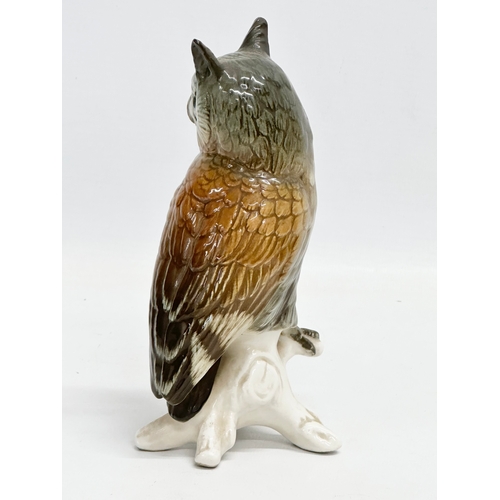 721 - A mid 20th century Karl Ens pottery owl on branch. 17cm.