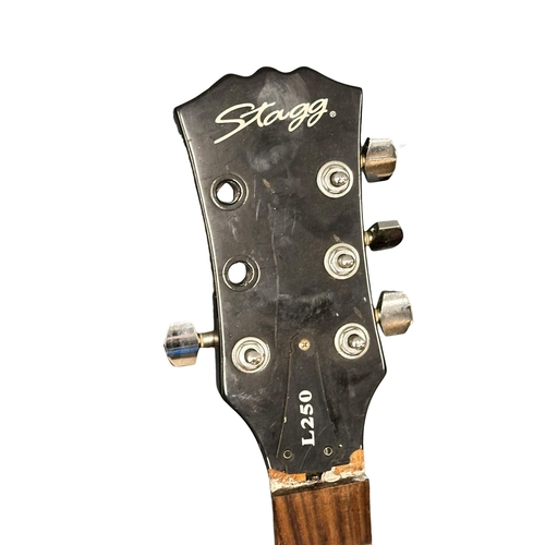 554 - A collection of guitars and cases. Stagg, Action etc.