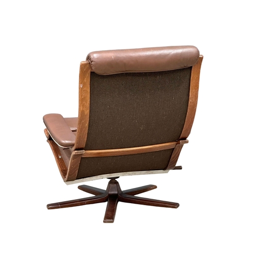 804 - A Swedish Mid Century leather swivel armchair by Gote Mobler. 1970. 1