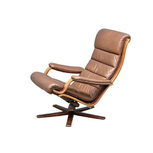 804 - A Swedish Mid Century leather swivel armchair by Gote Mobler. 1970. 1