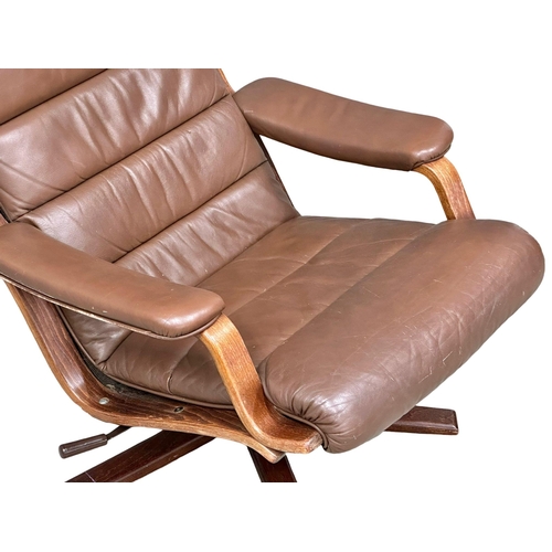 804 - A Swedish Mid Century leather swivel armchair by Gote Mobler. 1970. 1