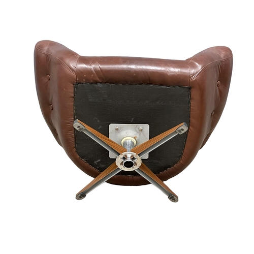 806 - A Swedish Mid Century Gungan Slatte leather swivel chair on faux rosewood base.1