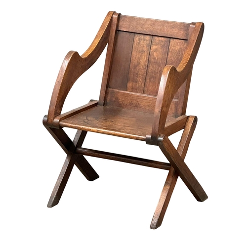 881 - A late 19th century Glastonbury oak armchair. Circa 1890-1900. 1