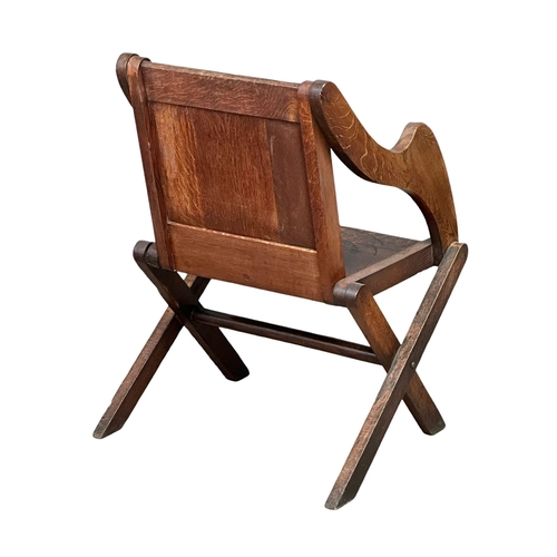 881 - A late 19th century Glastonbury oak armchair. Circa 1890-1900. 1