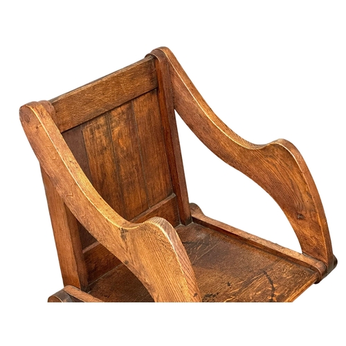 881 - A late 19th century Glastonbury oak armchair. Circa 1890-1900. 1