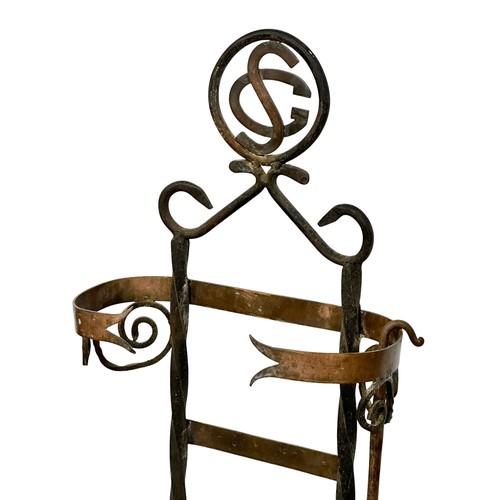 206 - A large late 19th century French Arts & Crafts wrought iron and copper companion set with granite ba... 