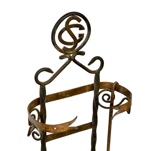 206 - A large late 19th century French Arts & Crafts wrought iron and copper companion set with granite ba... 