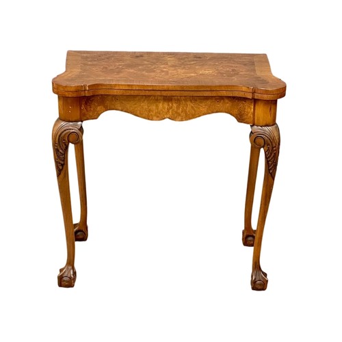 872 - A George III style Burr Walnut turnover games table on ball & claw feet. 76cm x 42cm x 74cm 3