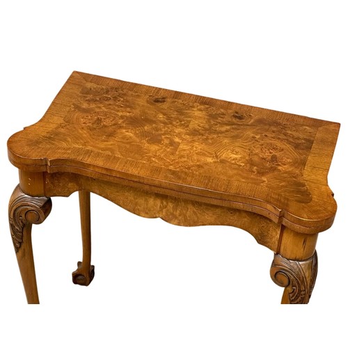 872 - A George III style Burr Walnut turnover games table on ball & claw feet. 76cm x 42cm x 74cm 3