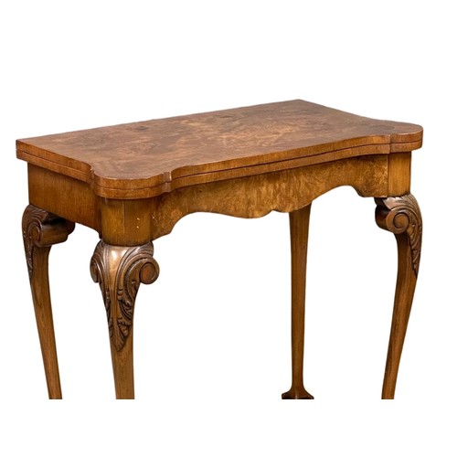 872 - A George III style Burr Walnut turnover games table on ball & claw feet. 76cm x 42cm x 74cm 3