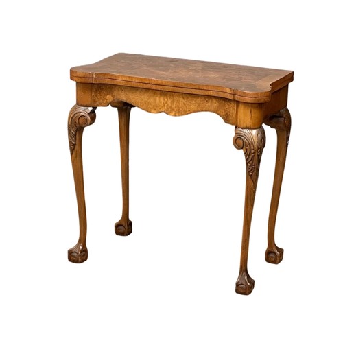 872 - A George III style Burr Walnut turnover games table on ball & claw feet. 76cm x 42cm x 74cm 3