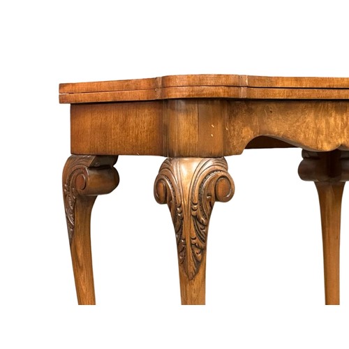 872 - A George III style Burr Walnut turnover games table on ball & claw feet. 76cm x 42cm x 74cm 3