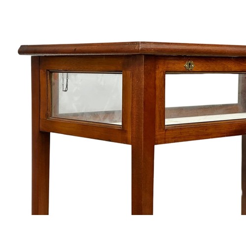 882 - A Sheraton Revival Inlaid mahogany display table with 4 glass panels and bevelled glass top. 85cm x ... 