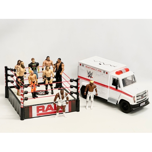 794B - Mattel 2020 WWE collection. A Raw WWE wrestling ring with 9 figures and a WWE ambulance. Ring measur... 