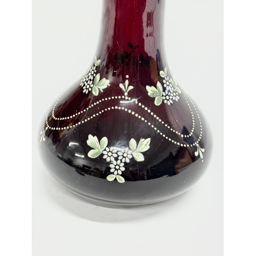 68 - A late 19th century Bohemian hand painted Ruby glass bottle vase. 14x22cm