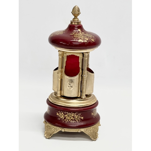 12 - An Italian Rouge brass musical lipstick holder. 28cm