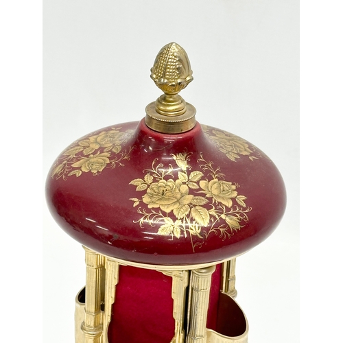 12 - An Italian Rouge brass musical lipstick holder. 28cm