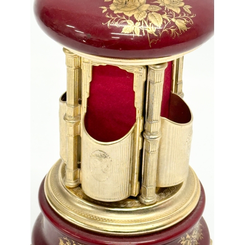 12 - An Italian Rouge brass musical lipstick holder. 28cm