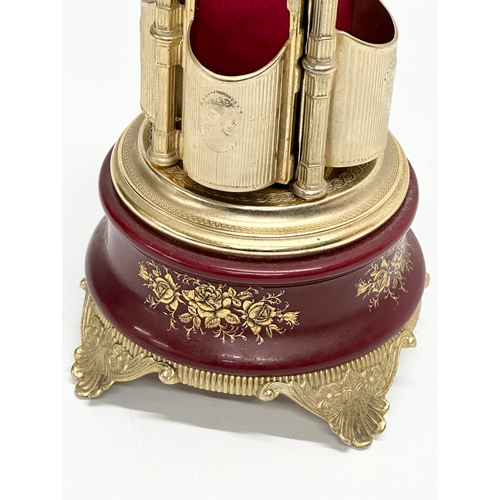 12 - An Italian Rouge brass musical lipstick holder. 28cm