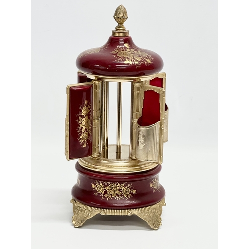 12 - An Italian Rouge brass musical lipstick holder. 28cm