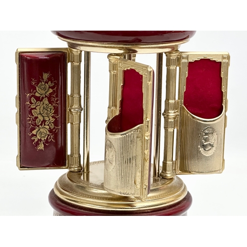 12 - An Italian Rouge brass musical lipstick holder. 28cm