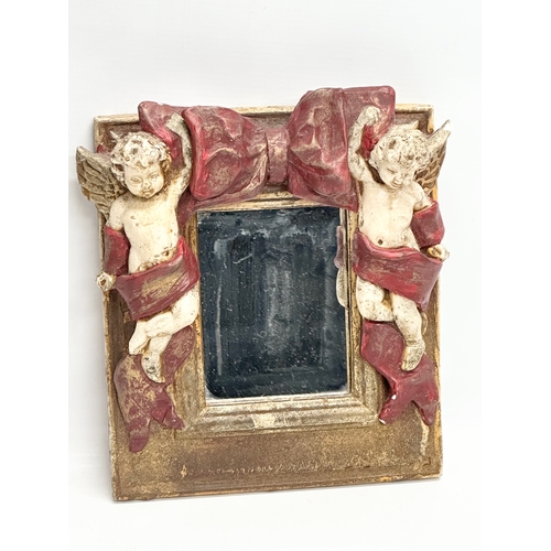 412 - A cherub wall bracket and mirror. 23x31cm. 23x23cm