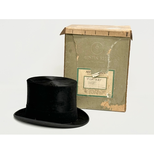 73 - An early 20th century Austin Reid top hat with original box. Circa 1910-1920.  Inside measurements, ... 