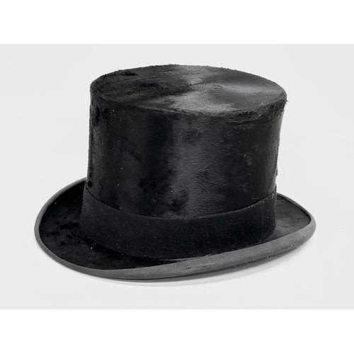 73 - An early 20th century Austin Reid top hat with original box. Circa 1910-1920.  Inside measurements, ... 