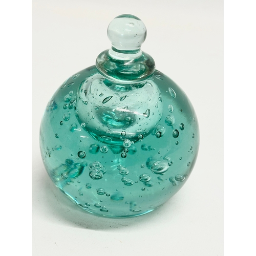 42 - A Victorian glass paperweight inkwell with stopper. 9x11cm