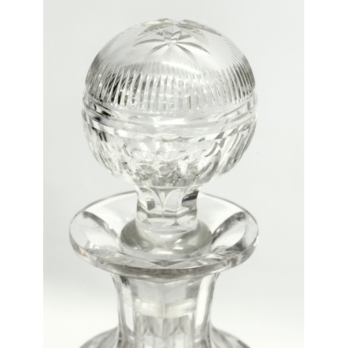 99 - A 19th Century Victorian notch cut decanter and stopper. 29cm