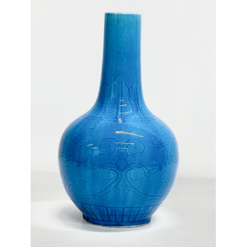 45 - A Chinese Turquoise glazed bottle vase. Early 20th Century. Circa 1900. 16x29cm