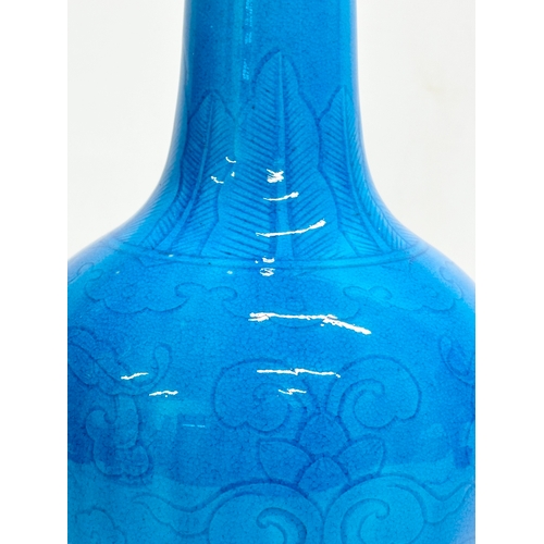 45 - A Chinese Turquoise glazed bottle vase. Early 20th Century. Circa 1900. 16x29cm