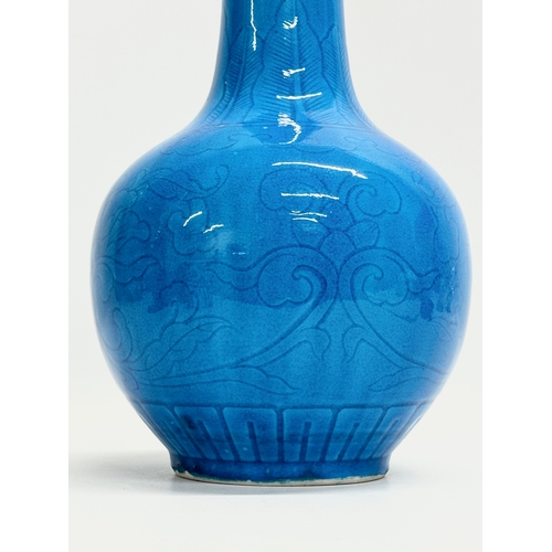 45 - A Chinese Turquoise glazed bottle vase. Early 20th Century. Circa 1900. 16x29cm