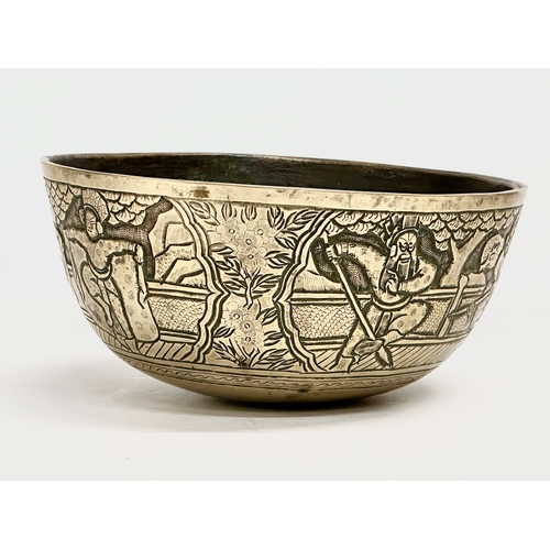 118 - A large Chinese heavy brass bowl. Late 19th/Early 20th Century. 25.5x12cm