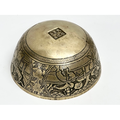 118 - A large Chinese heavy brass bowl. Late 19th/Early 20th Century. 25.5x12cm