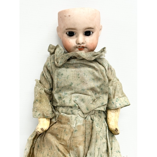 3 - An Early 20th Century SFBJ 60 (The Societe Rancaise de Fabrication de Bebes et Jouets) porcelain dol... 