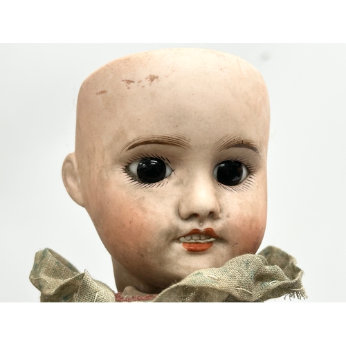 3 - An Early 20th Century SFBJ 60 (The Societe Rancaise de Fabrication de Bebes et Jouets) porcelain dol... 